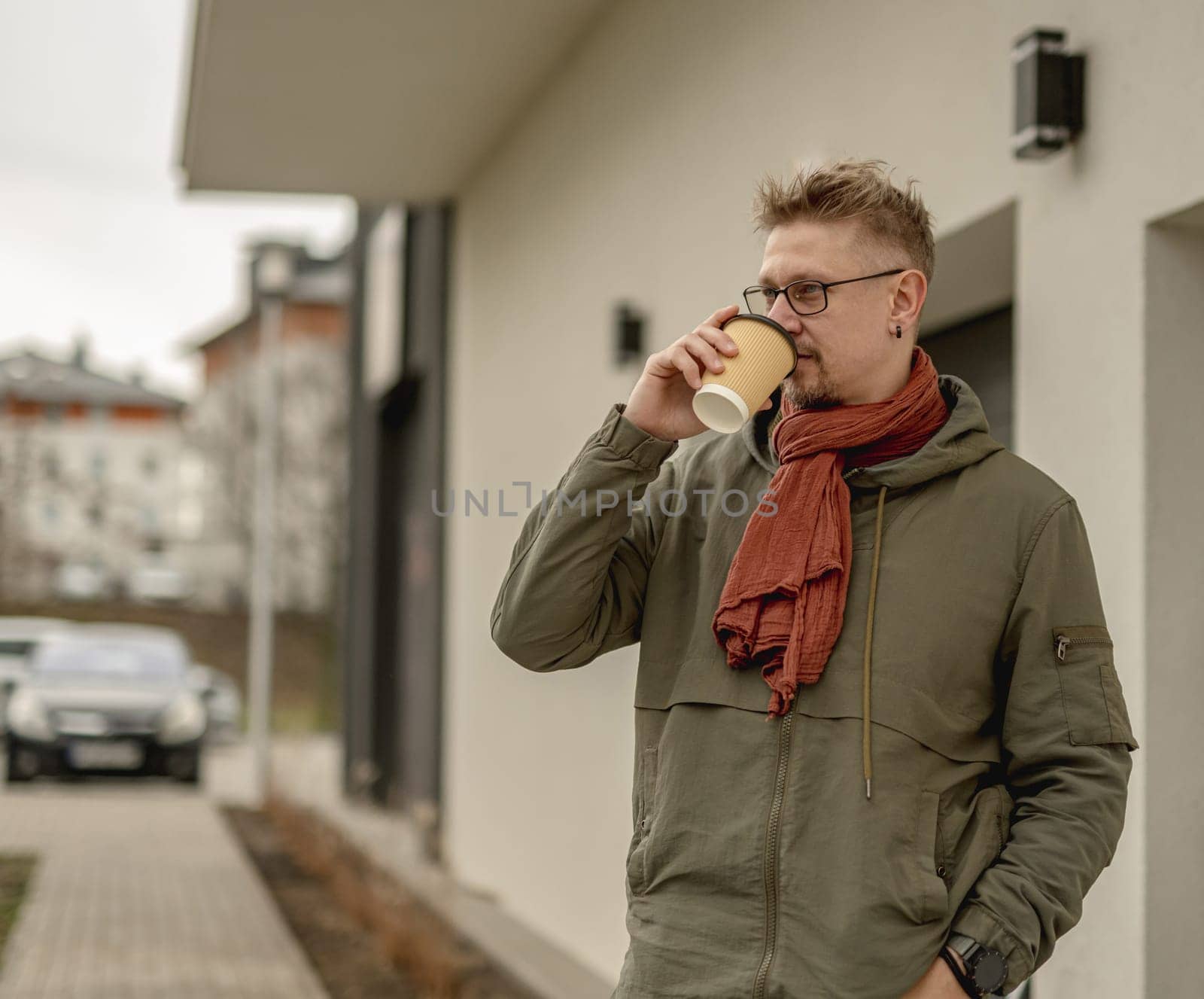Young Attractive Man On The Street Relaxing Outdoors During A Break