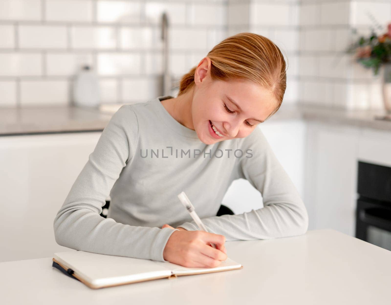 Cute Little Girl Happily Doing Writing Homework