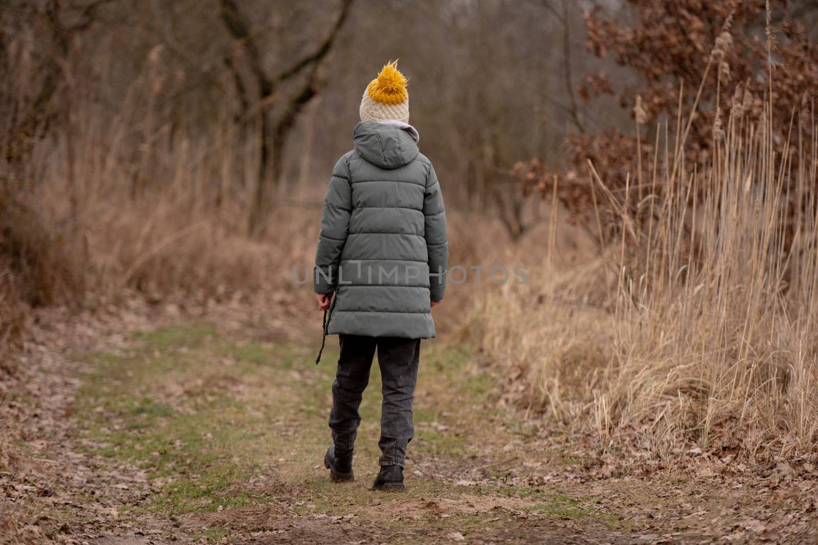 Girl In The Forest In Early Spring Viewed From Behind