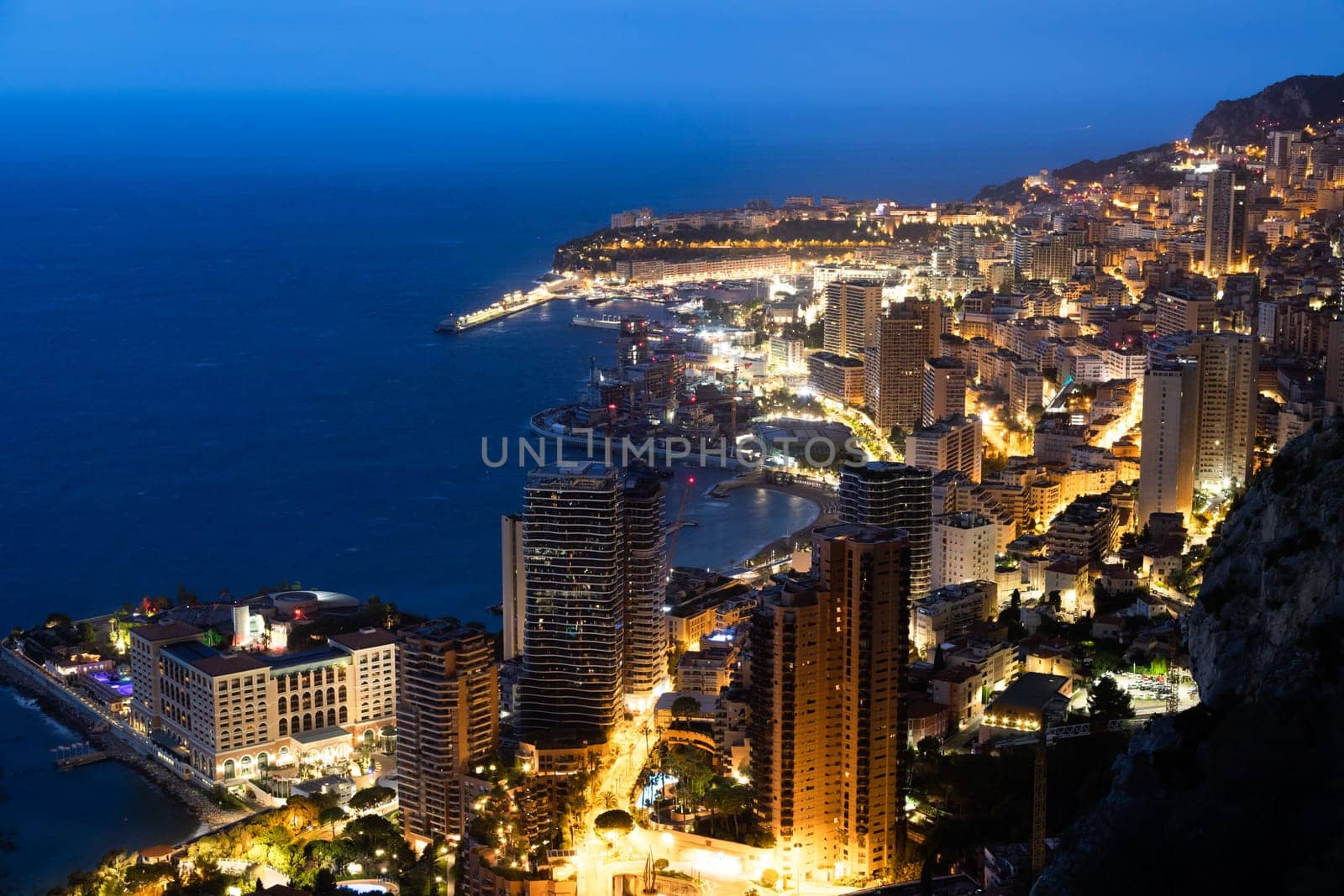Monte Carlo panorama illuminated by night. Urban landscape with luxury architecture