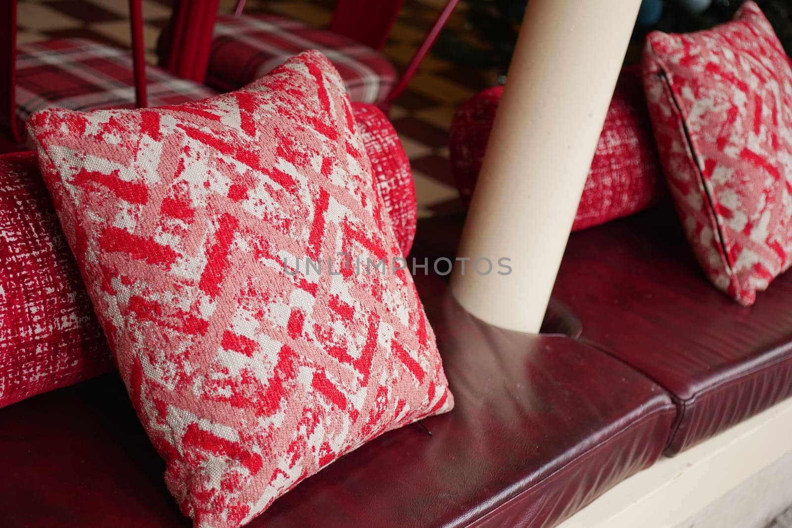 Comfortable red cushions enhance the inviting atmosphere of this space.