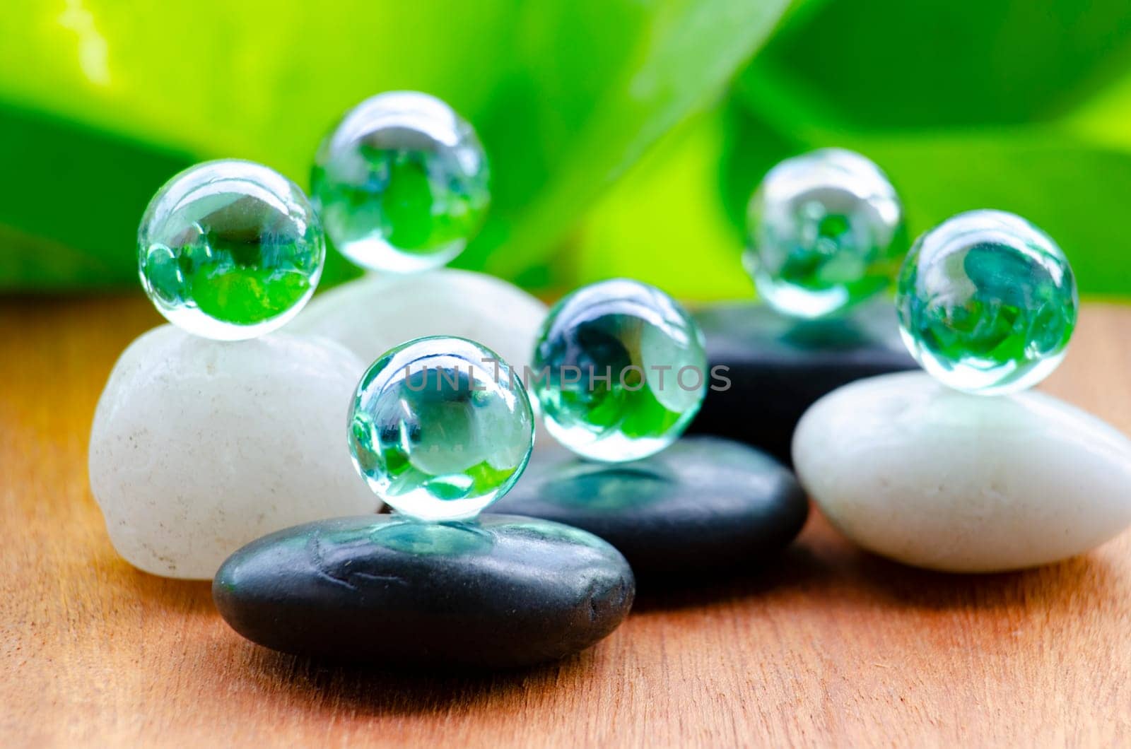 Glass marbles representing peace and harmony with customizable space for text of message.