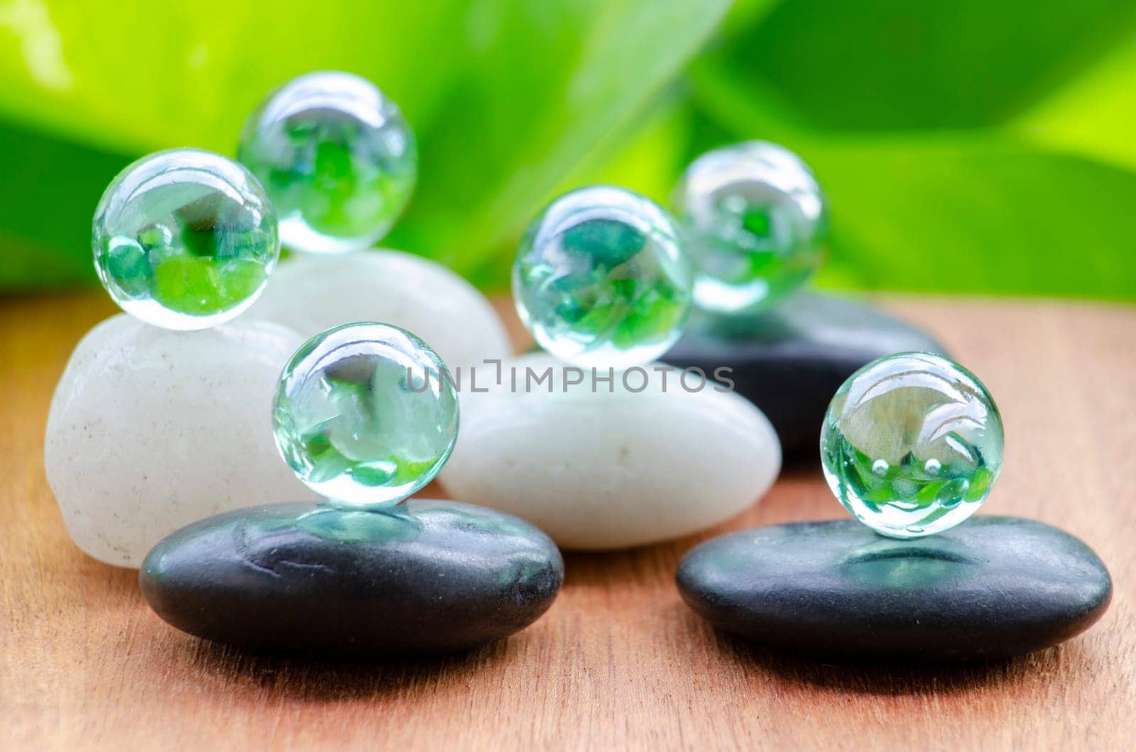 Glass marbles representing peace and harmony with customizable space for text of message. Peace concept.
