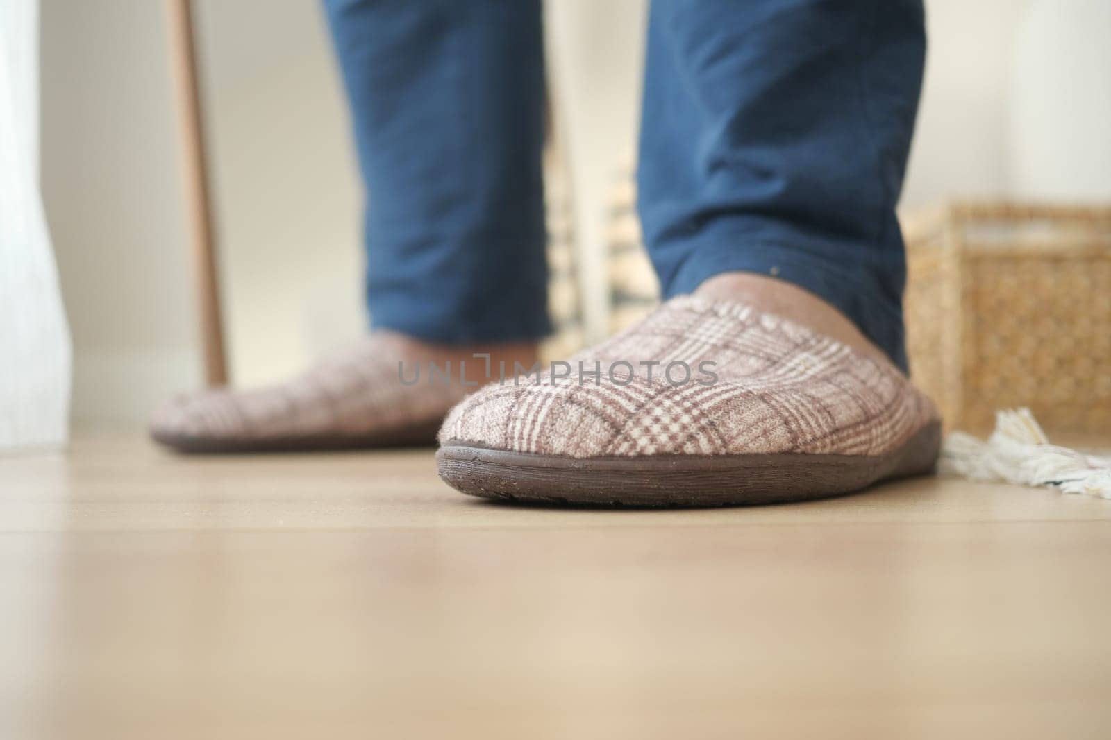A person is relaxing in comfortable slippers while indoors.