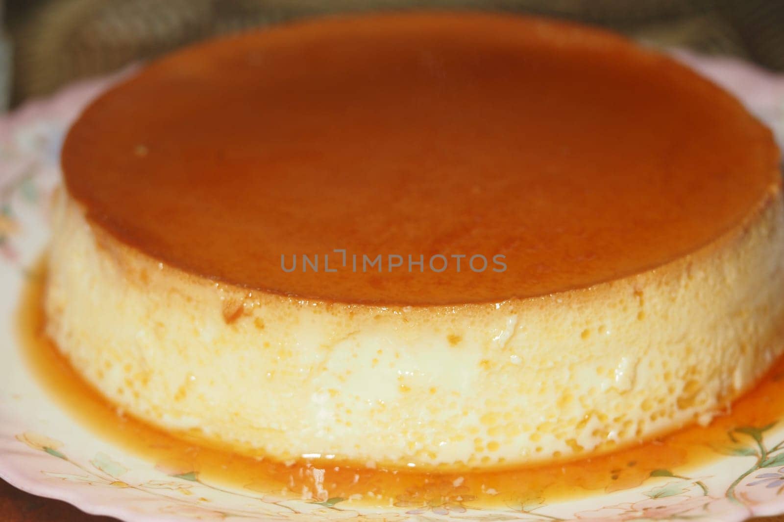 caramel pudding on a plate .