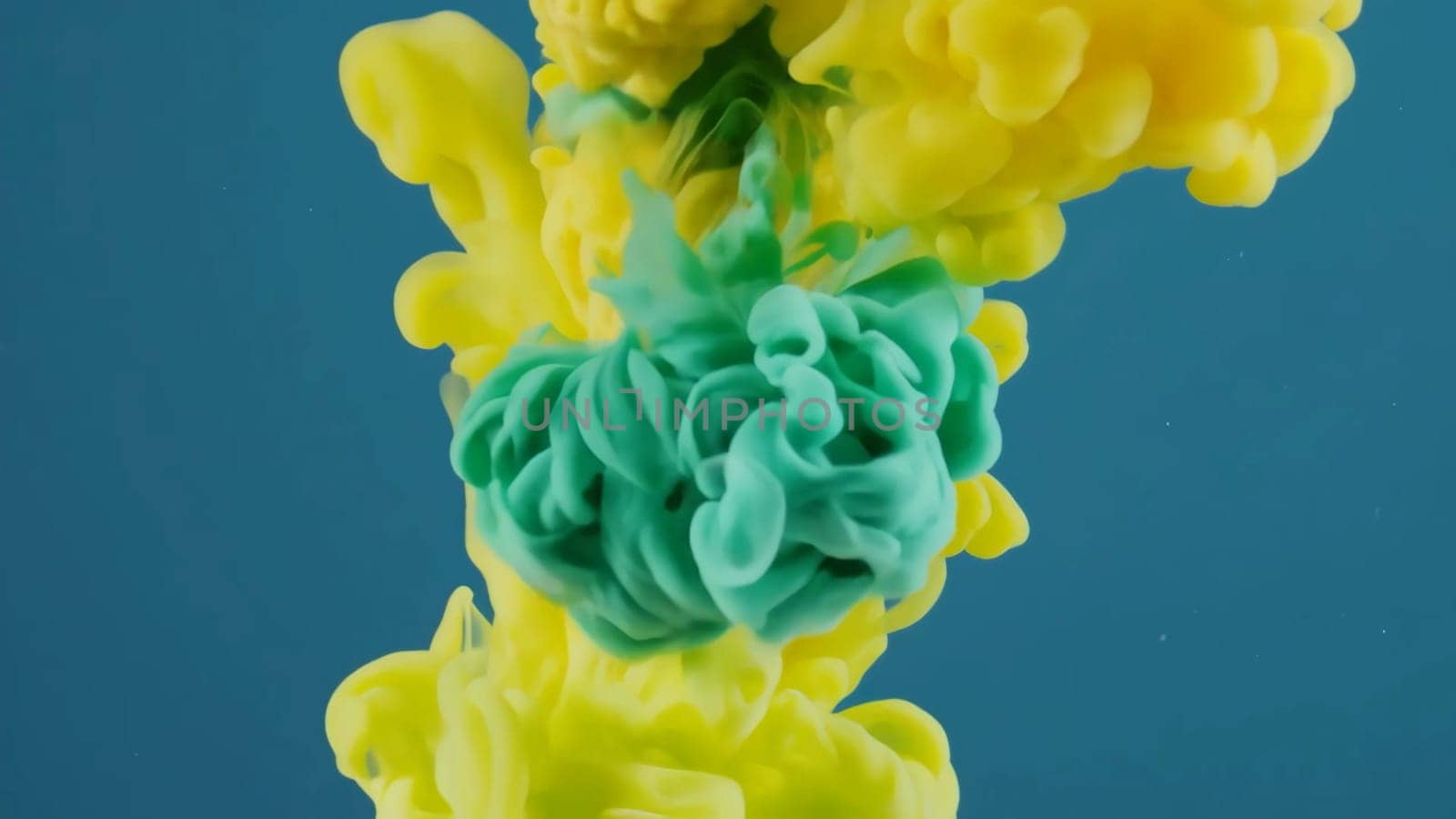Colorful flowing ink and liquid paint blend seamlessly in a striking backdrop, showcasing a mesmerizing dance of vibrant hues that captivate the viewers attention.
