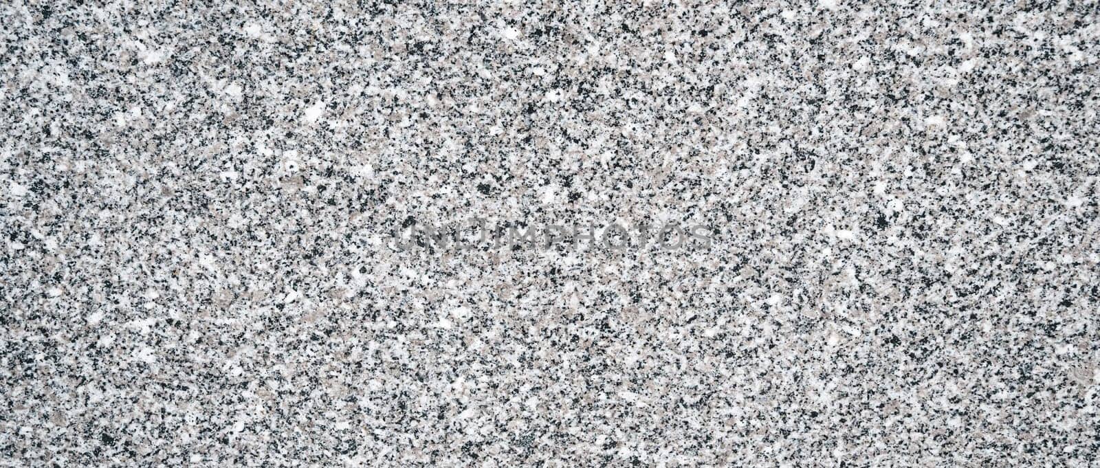 background with a white granite stone texture with black speckles for paving slabs