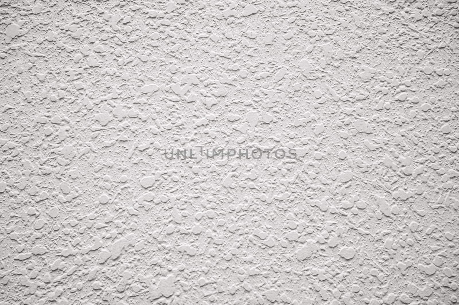 white background with textured plaster pattern. Abstract light background