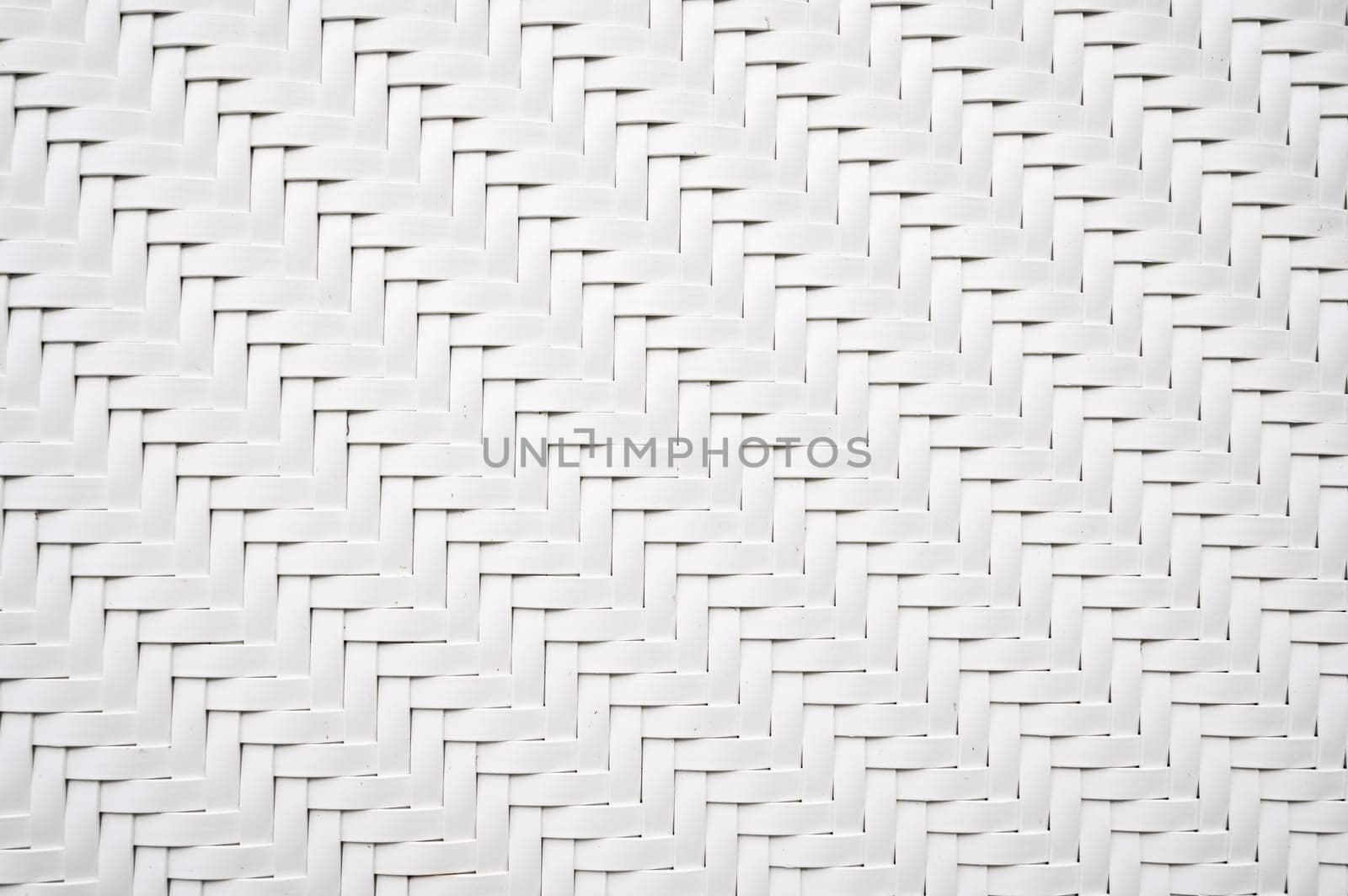 white background with artificial texture of woven rattan. Abstract braided Pattern