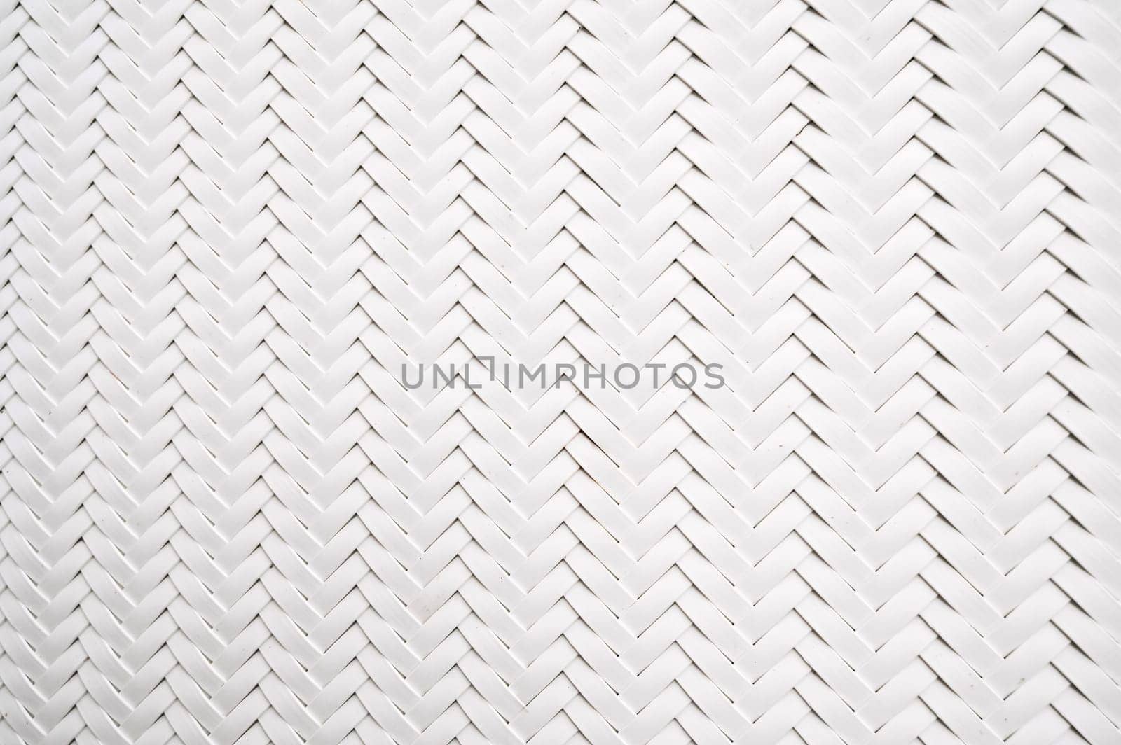 abstract white background with artificial plastic texture of woven rattan. Abstract braided Pattern