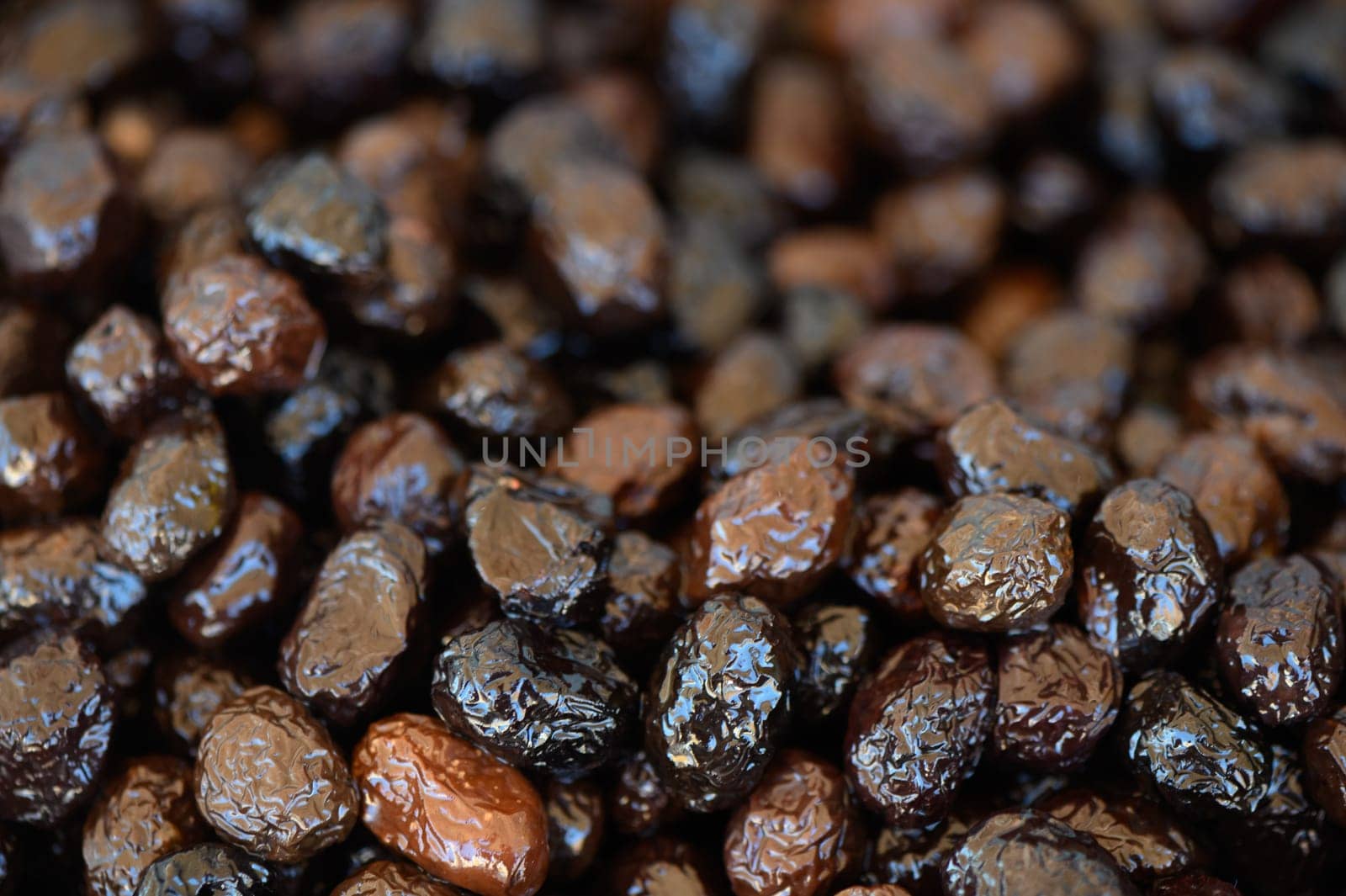Luscious, shiny dried fruits are displayed together, offering a tempting treat for health-conscious food lovers.