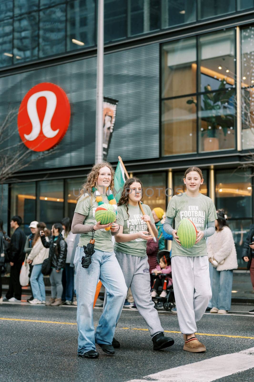 Enthusiastic participants are enjoying a vibrant and lively street parade event