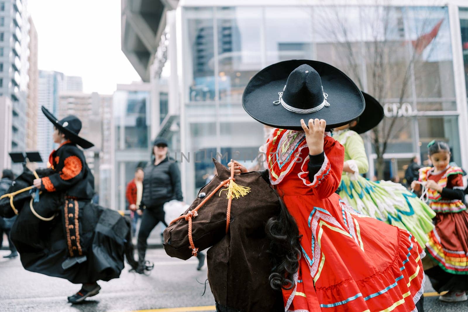 The colorful costumes of performers created a festive atmosphere during the parade