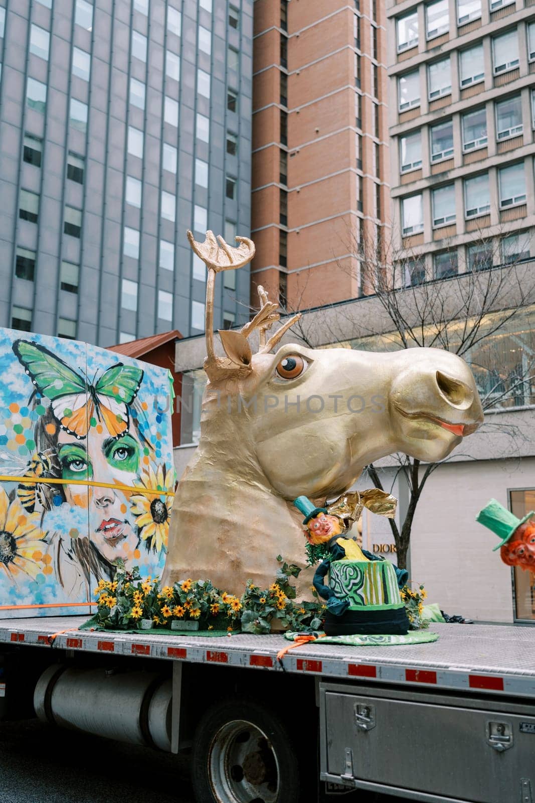 Colorful parade float with a whimsical animal head and vibrant artwork
