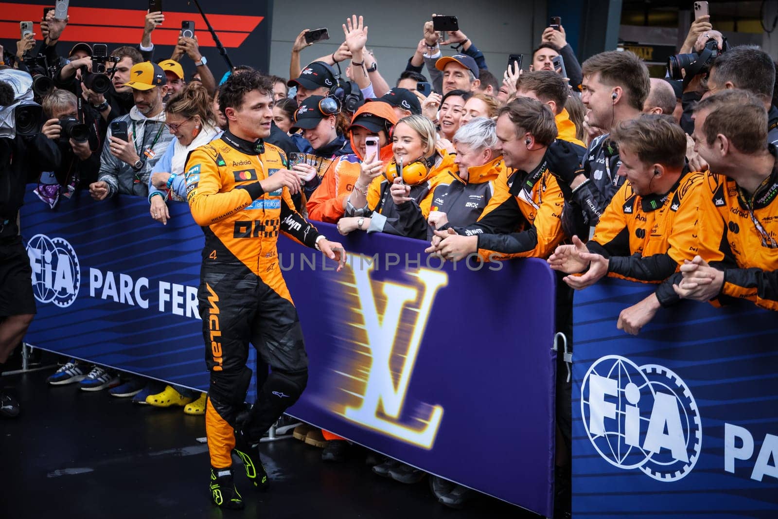 Lando Norris of Great Britain and McLaren Formula 1 Team celebrates winning the Australian Formula 1 Grand Prix with his team at Albert Park in Melbourne, Australia