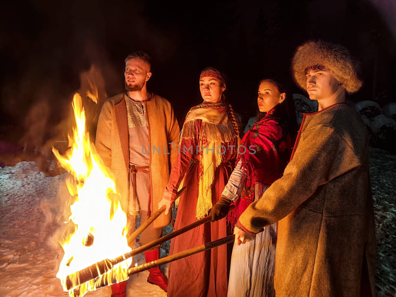 Actors dressed as Vikings present a captivating fire show, showcasing bravery and strength in winter's cold embrace.