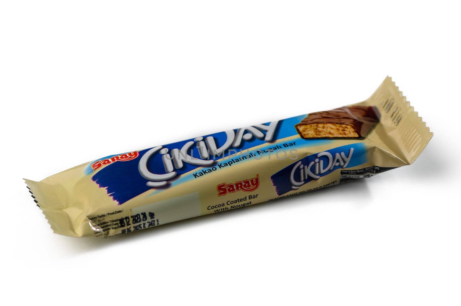 Gaziveren Cyprus -15.02.2025 A delicious cocoa covered nugget bar rests on a clean white surface, showcasing its tempting flavor and texture.