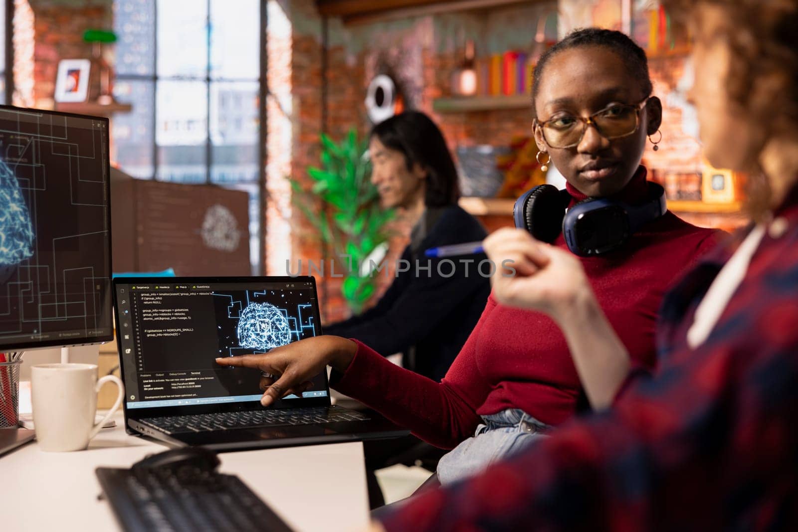 Startup engineers leveraging artificial intelligence tech in workspace to gain competitive edge. Silicon Valley company IT professionals cooperating to do rapid technological advancement