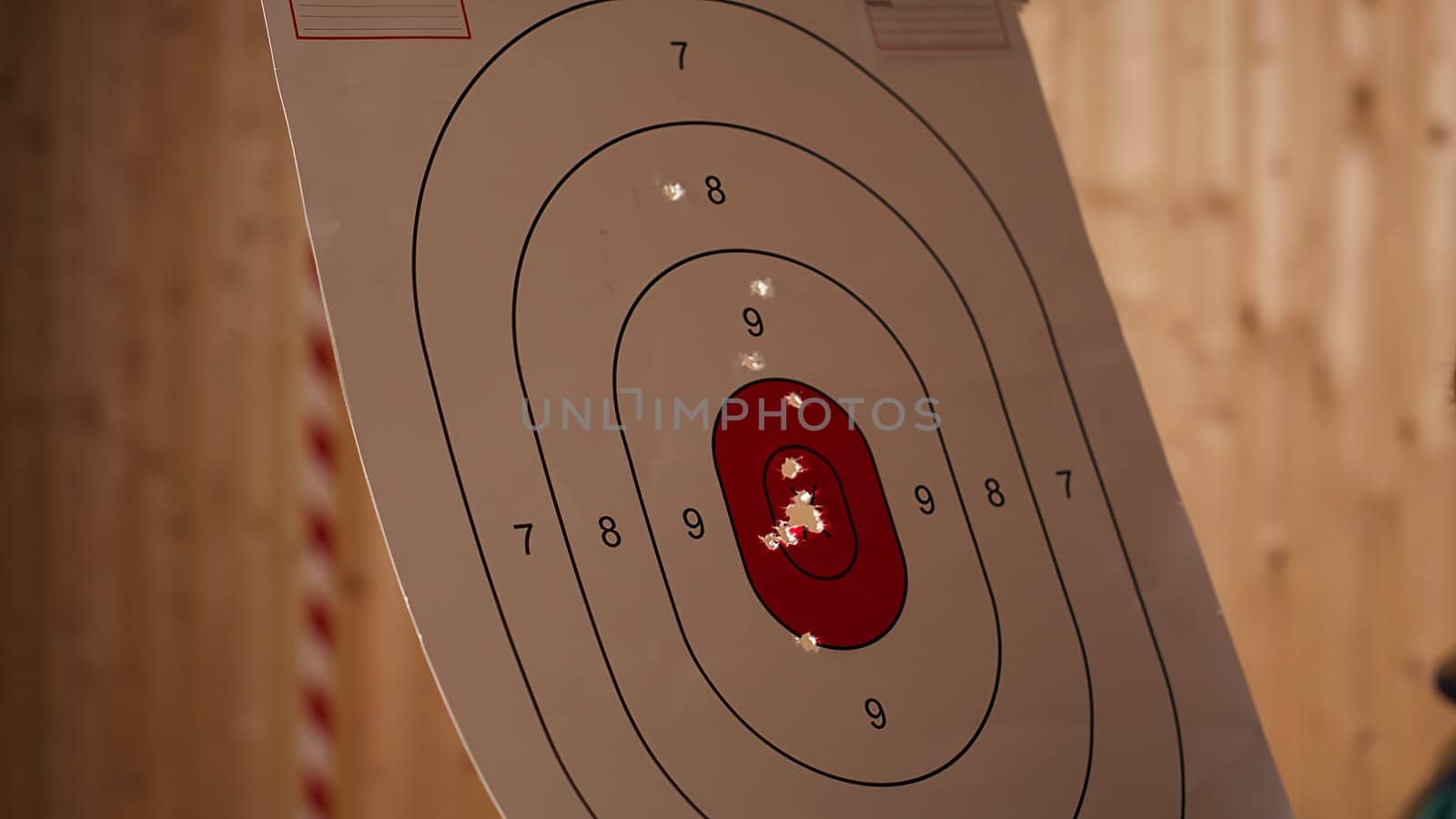 Man enjoying recreational shooting experience in firing range, checking if he shot bullseye. Person practicing with weapons in safe environment at shooting range company, hitting targets, camera B