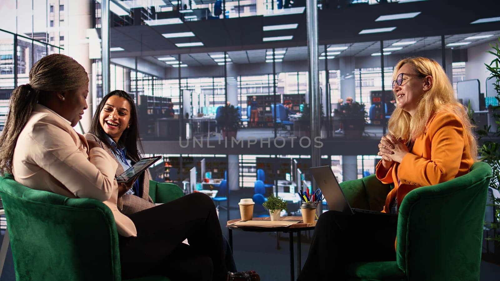 Ambitious businesswomen collaborating in a corporate office, fostering gender equality in a men dominated business industry. and leadership growth. Success driven powerful leaders. Camera B.