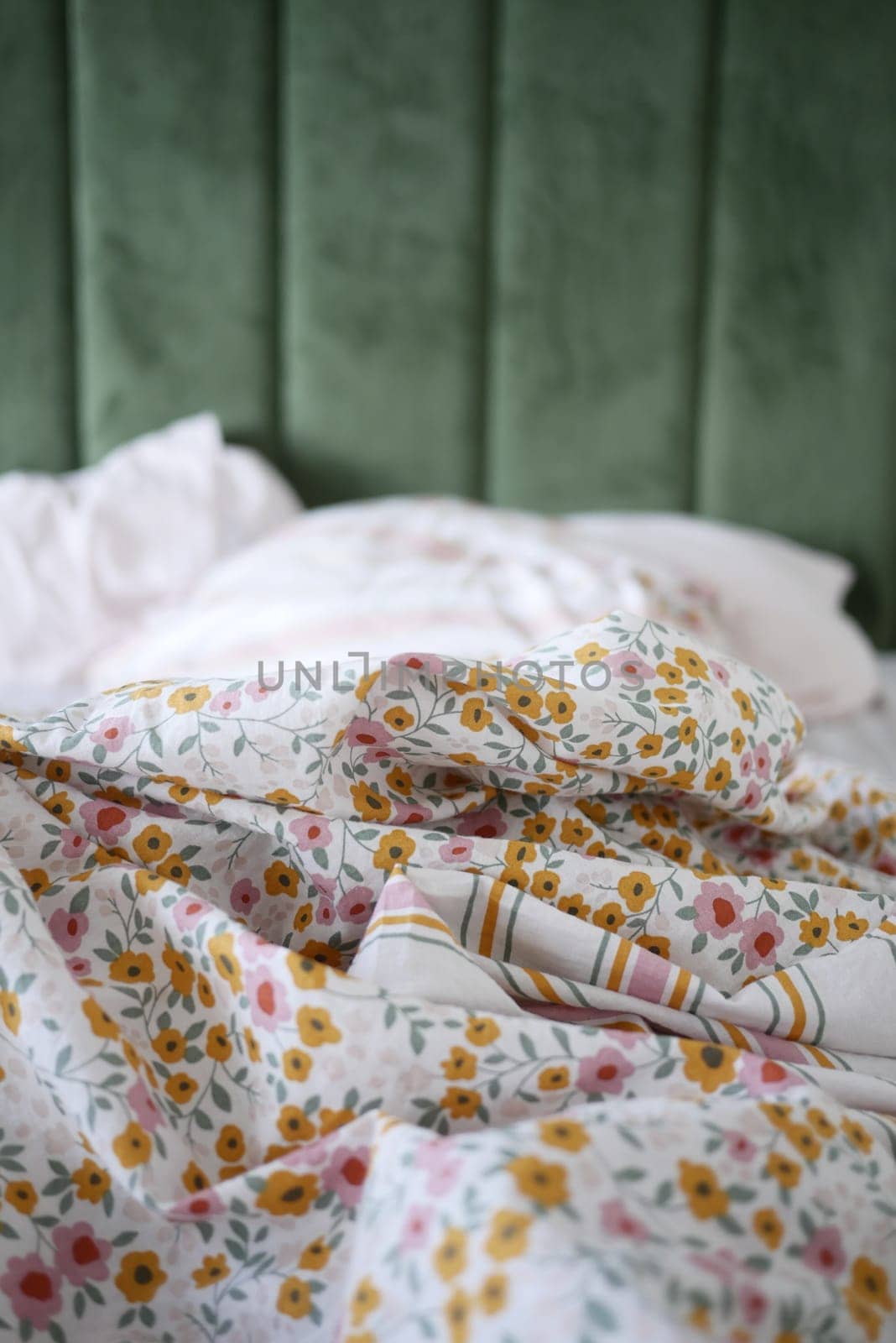 Soft floral sheets create a warm and inviting atmosphere in a bedroom.