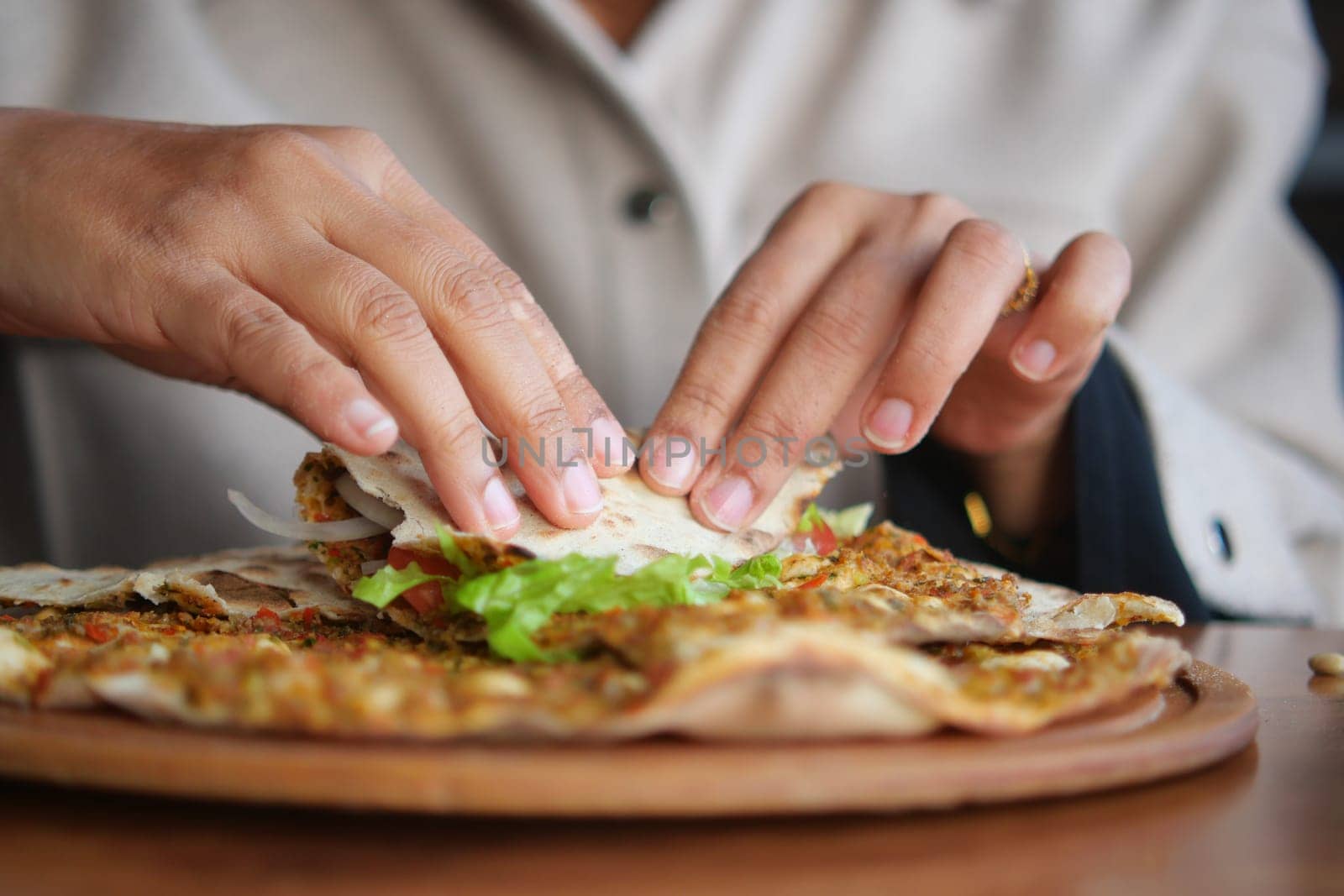 woman Preparing fresh turksih Lahmacun .