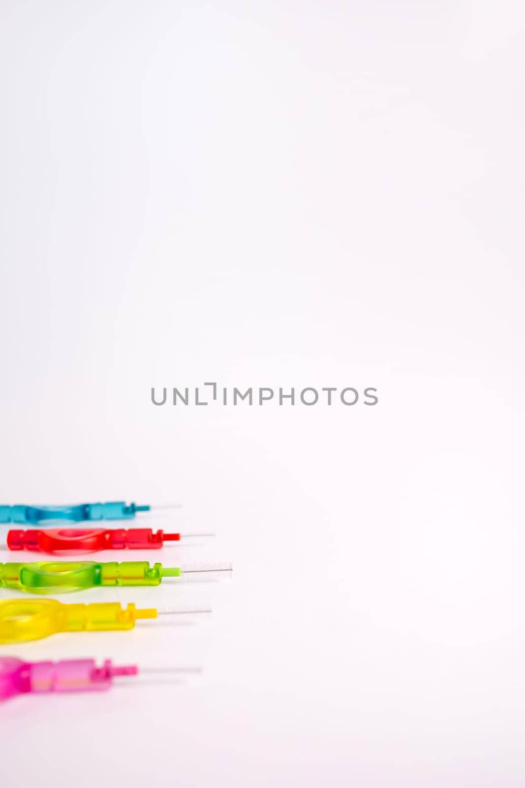 Mockup Isolated Many Colorful Interdental, Dental Brush Angle, Toothpick for Teeth Cleaning, Braces On Yellow Peach Background. Flatly Dentistry, Oral Health Hygiene. Copy Space Flossing Oral Brush.
