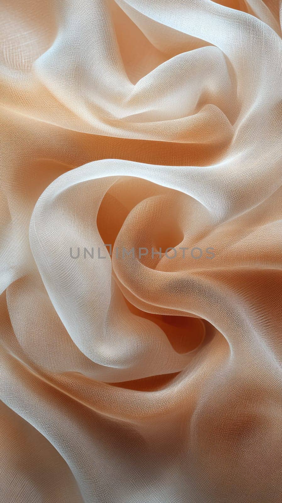 Delicate peach and white fabric is elegantly arranged, showcasing its smooth texture and flowing drapes. The soft hues blend beautifully, creating a serene aesthetic.