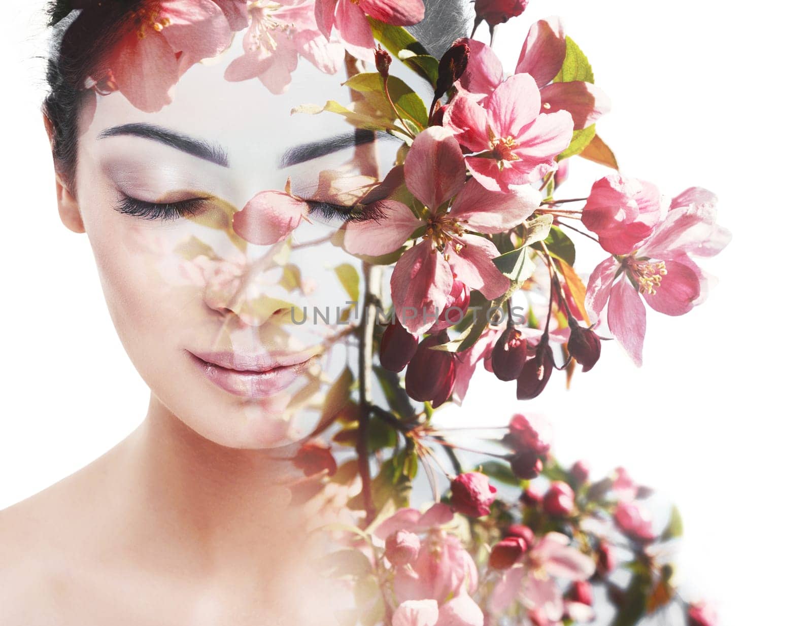 Unity of human with nature, beauty of youth and femininity. Double exposure portrait of young pretty woman combined with bright spring garden flowers