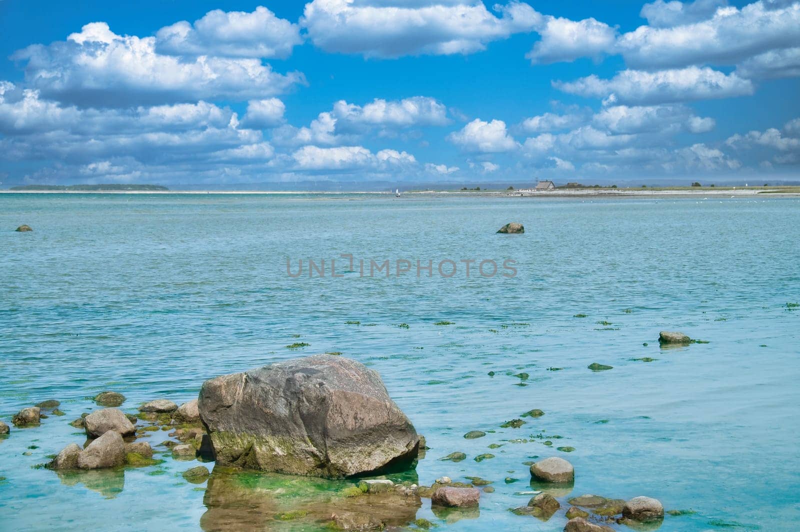Stones and rocks on the Baltic coast in the sea. Landscape shot in sunshine. Nature from germany