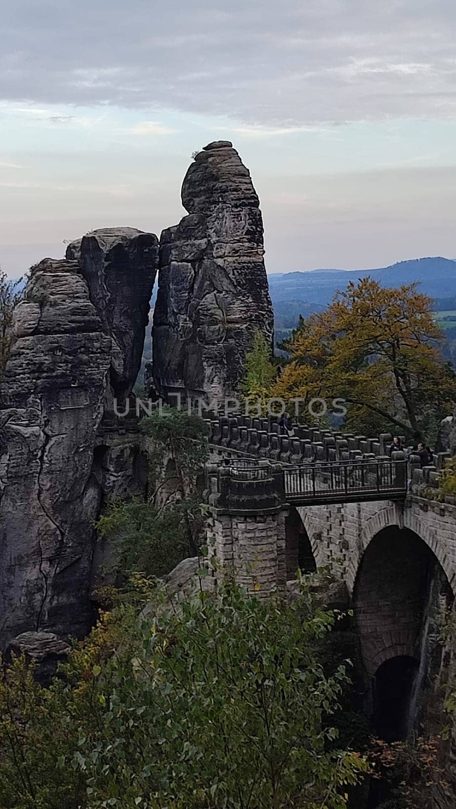 Ancient stone bridge shotlisttravel building architecture opendoor nature reserve park green autumn summer day shotlisttravel travel tourism sky landscape background trees . photo evening rock forest