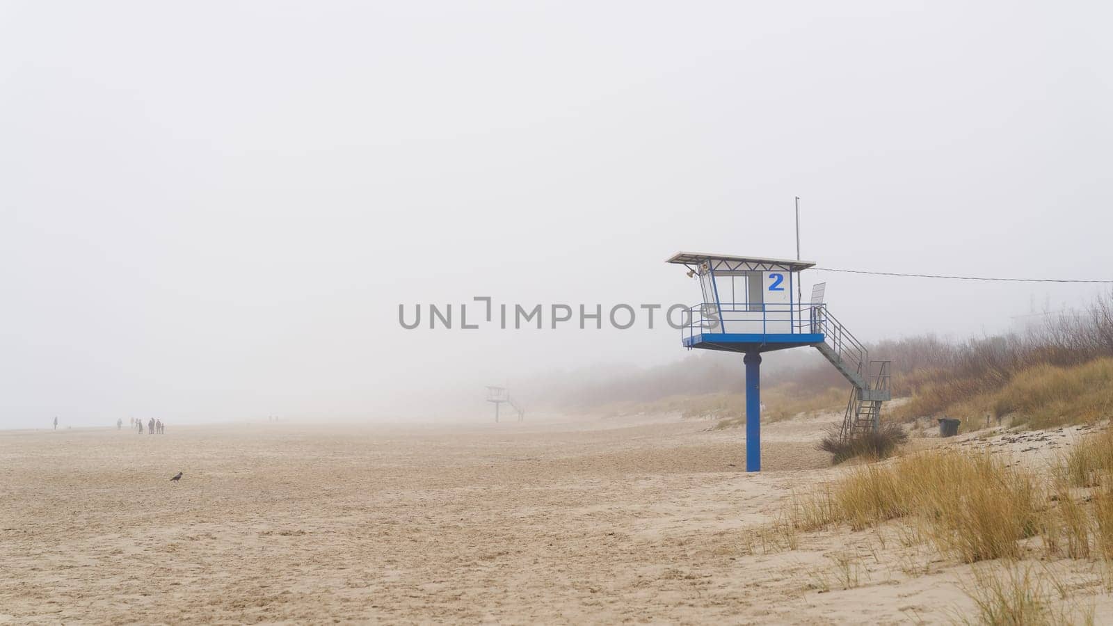 Ahlbeck beach on the German Baltic Sea with rescue tower in winter