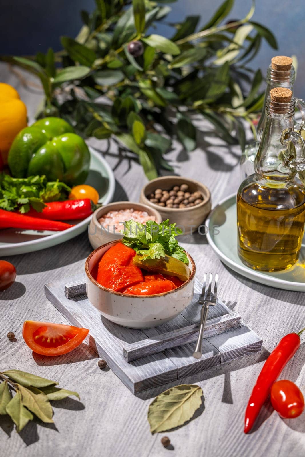 Bowl of sun dried tomatoes, fresh parsley, vibrant vegetables, and aromatic herbs creating an inviting culinary scene