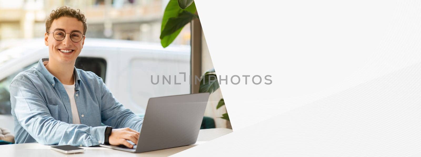 Smiling proud millennial european guy student in glasses, typing on computer, work, study online, chatting in cafe. Online meeting, lifestyle remotely, digital nomad, freelance