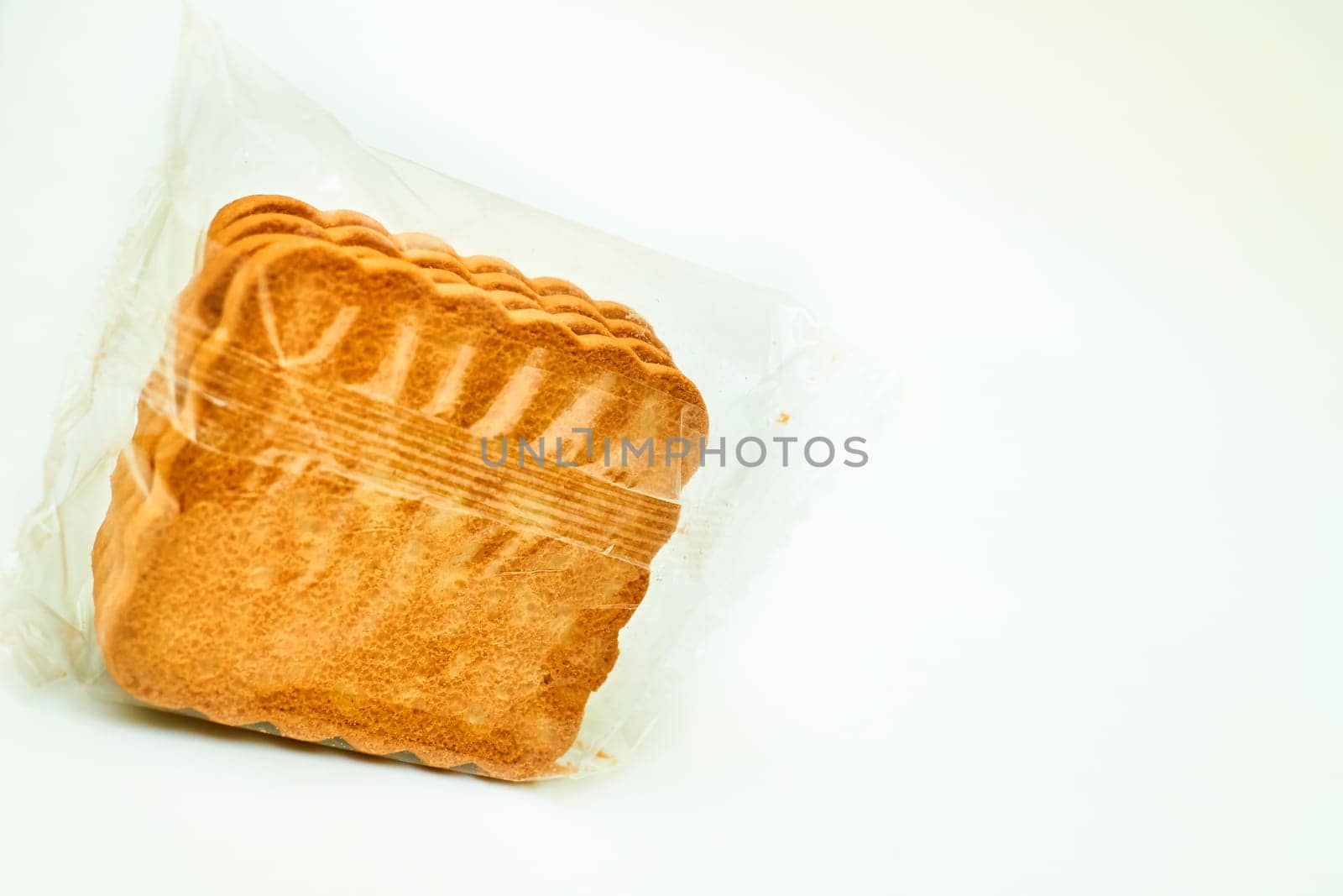Confectionery made from pieces of sweet dough. materials used to wrap or protect goods