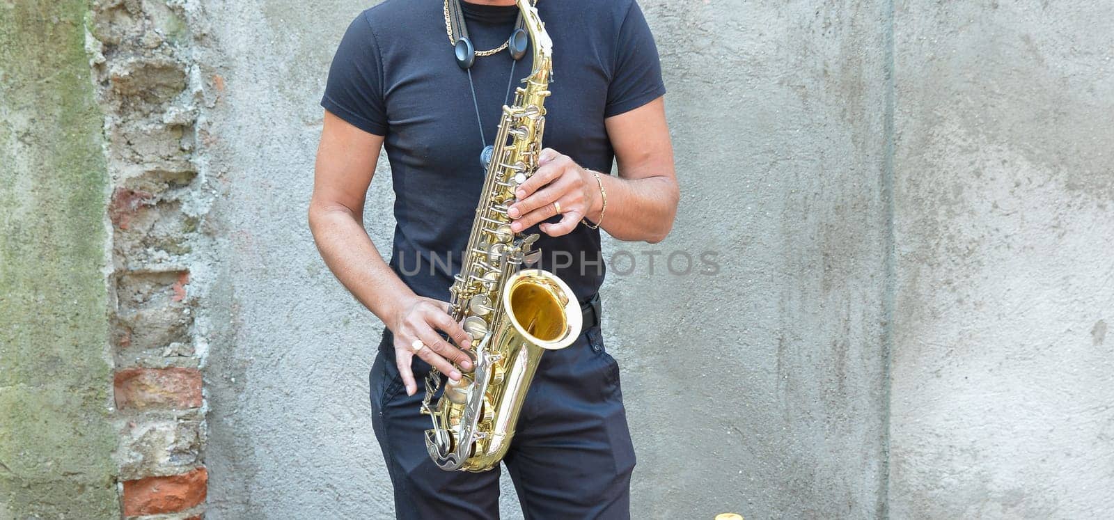 A talented saxophonist plays passionately, bringing music to life.