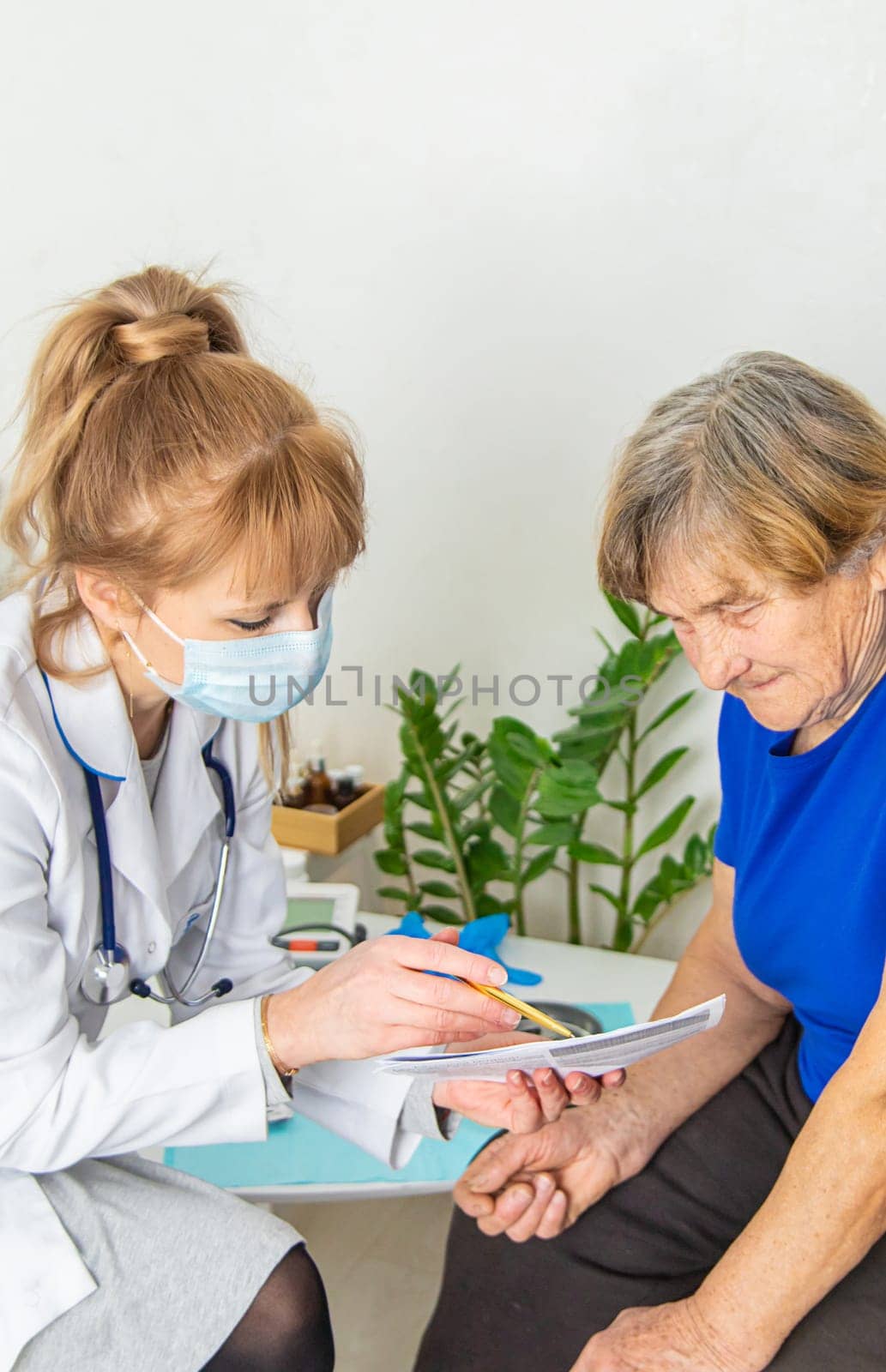 Elderly woman at a doctor appointment. Selective focus. People.