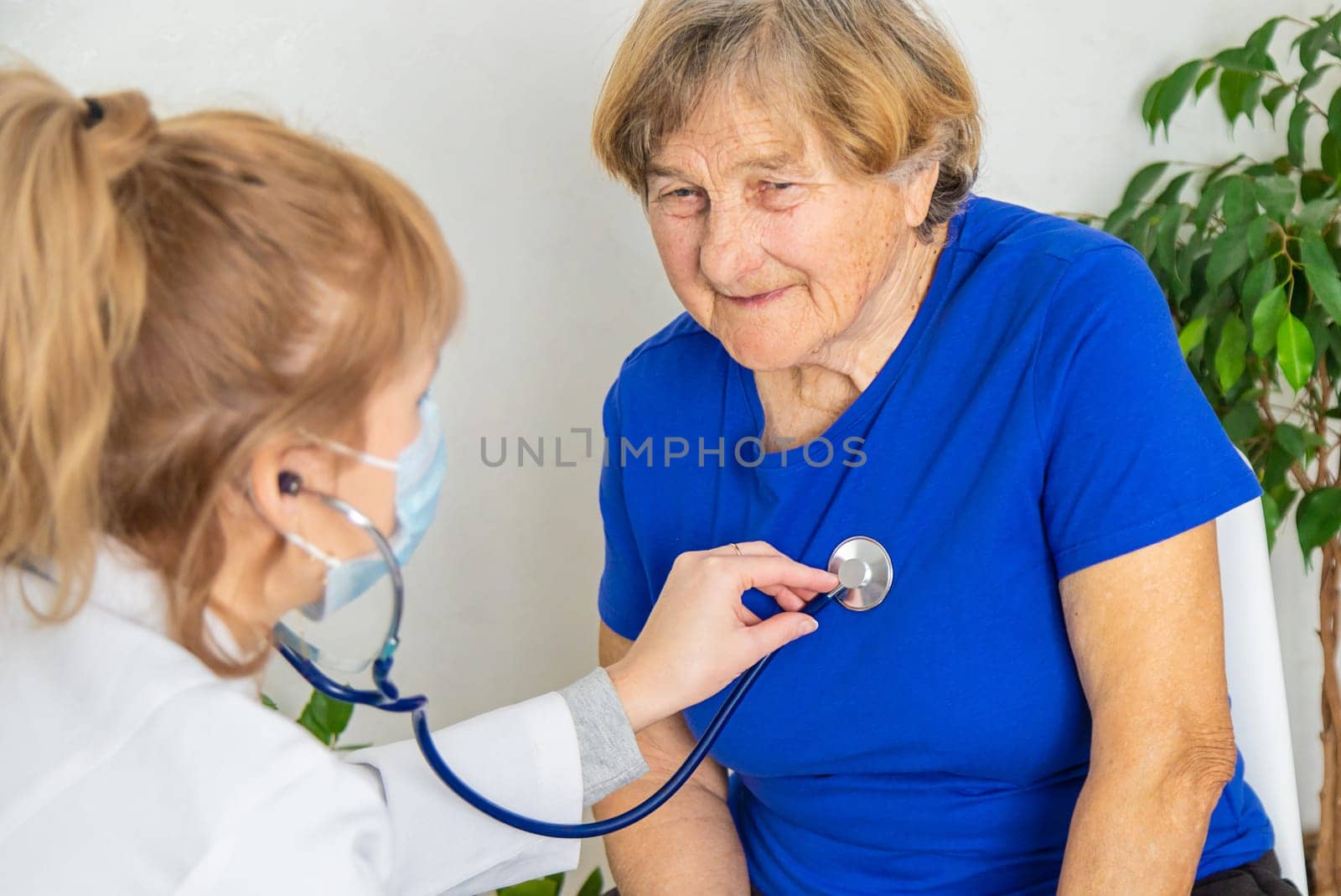 Elderly woman at a doctor appointment. Selective focus. People.