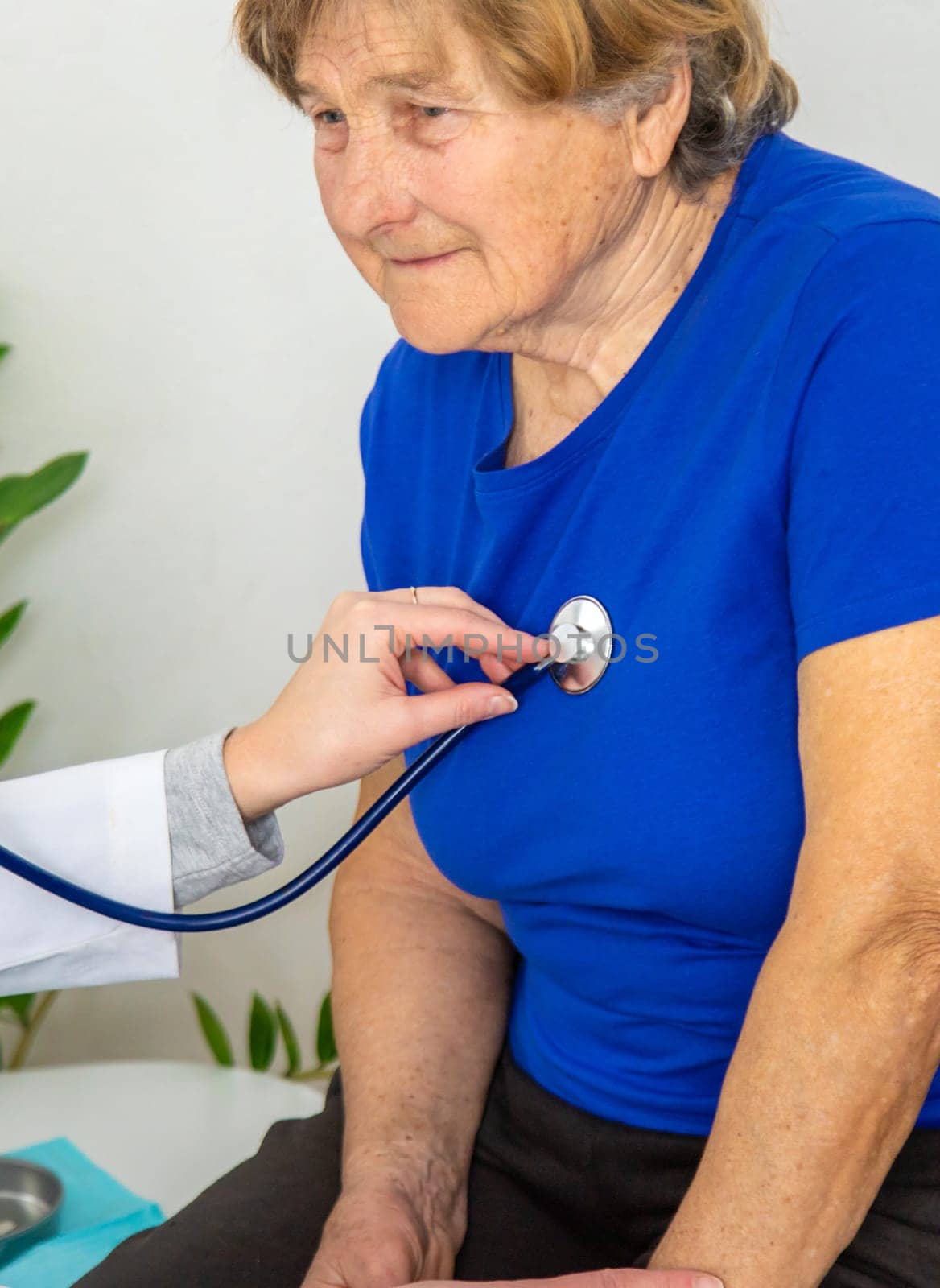 Elderly woman at a doctor appointment. Selective focus. People.