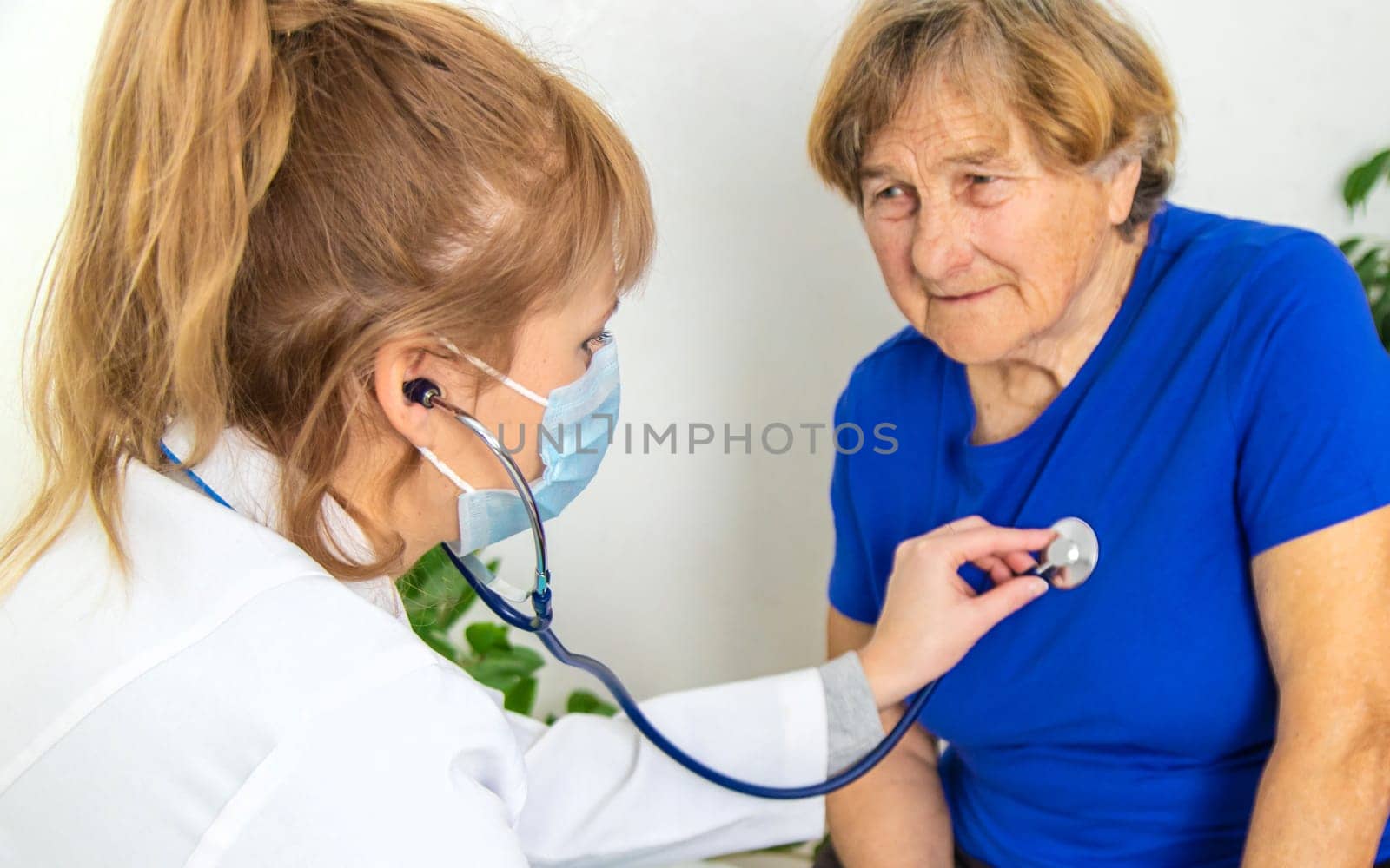 Elderly woman at a doctor appointment. Selective focus. People.