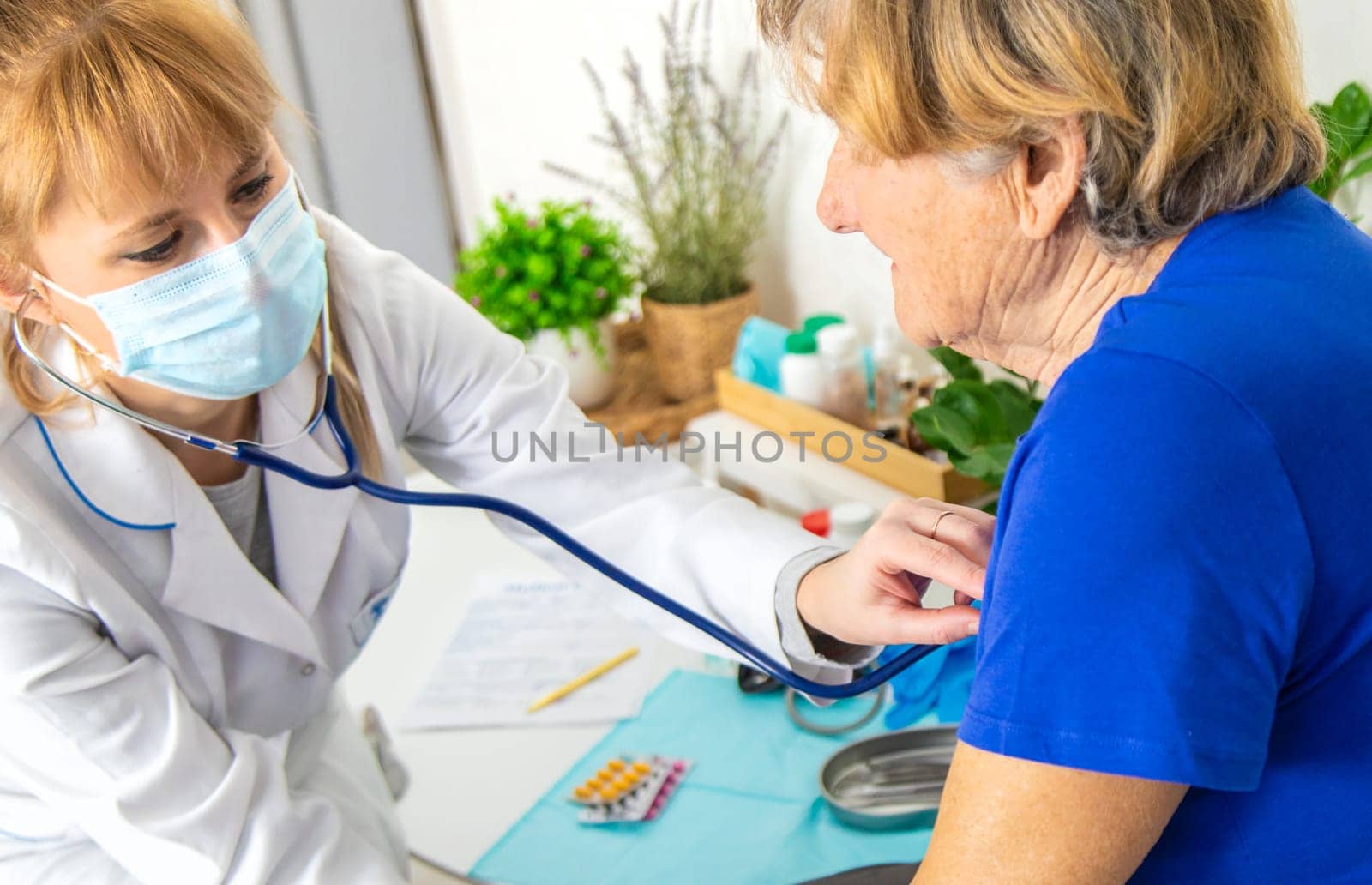 Elderly woman at a doctor appointment. Selective focus. People.