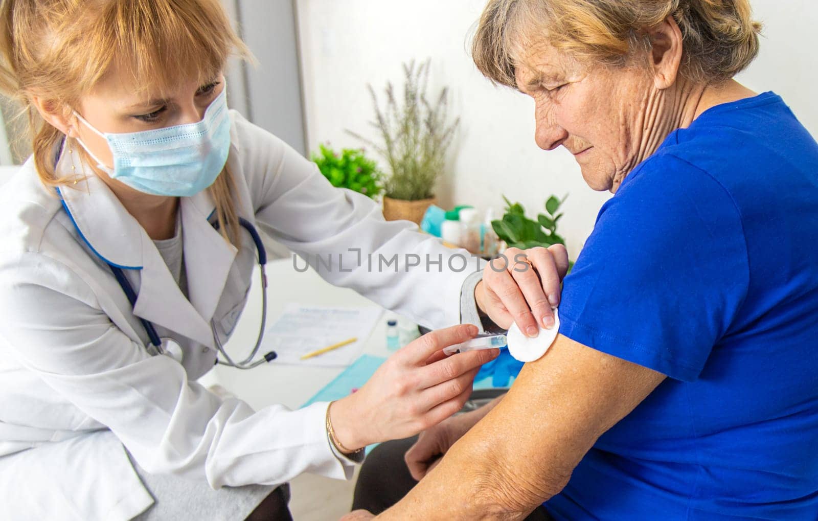 Elderly woman at a doctor appointment. Selective focus. People.