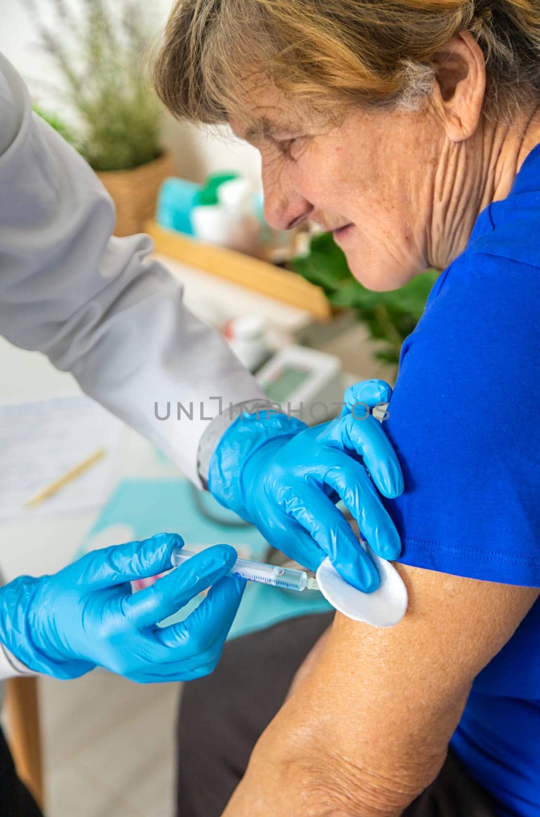 Elderly woman at a doctor appointment. Selective focus. People.