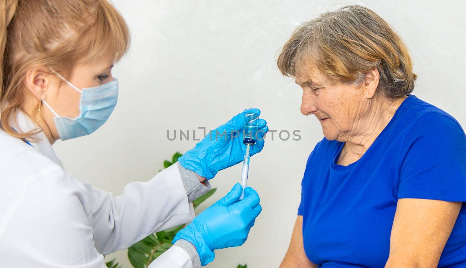 Elderly woman at a doctor appointment. Selective focus. People.