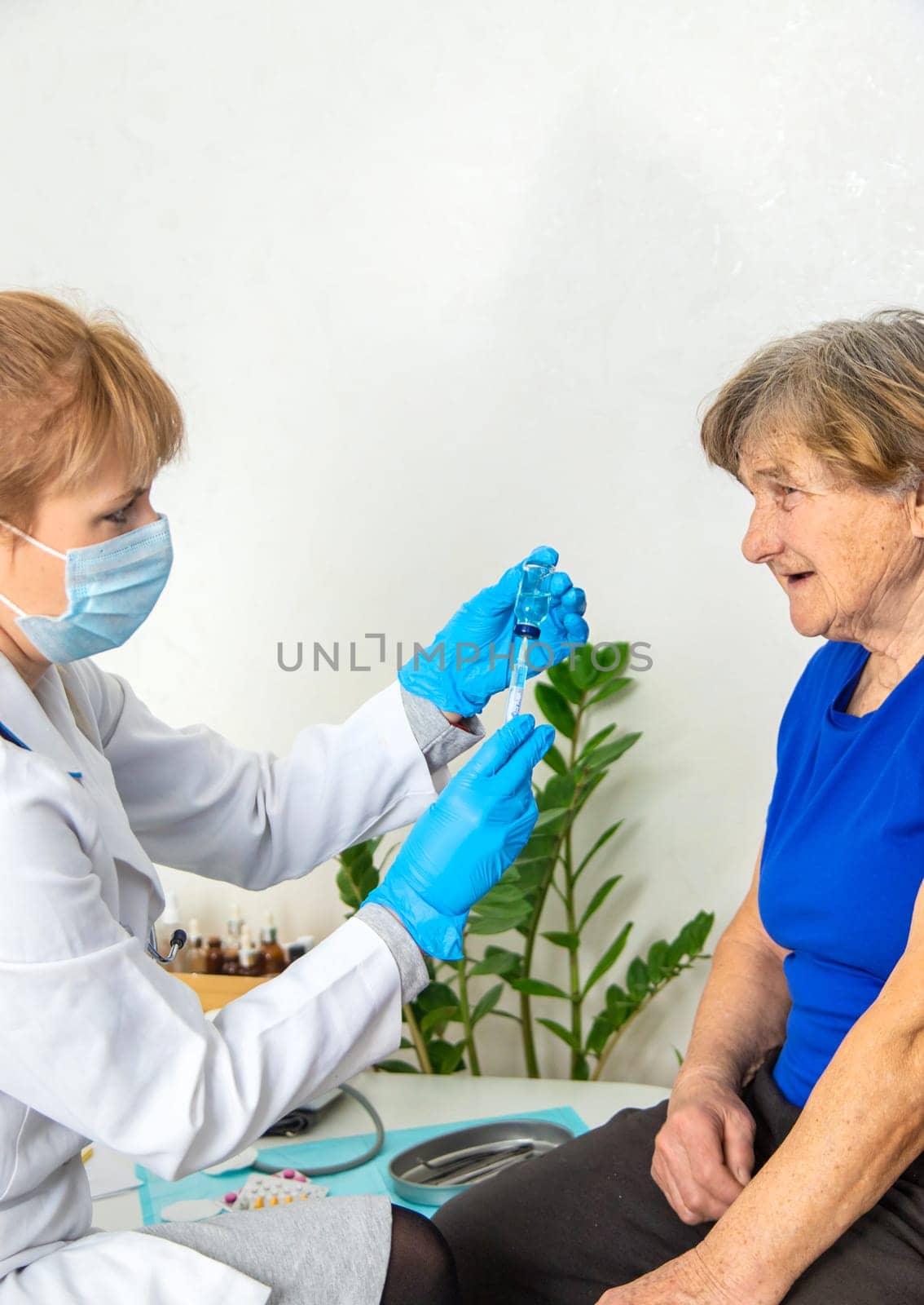 Elderly woman at a doctor appointment. Selective focus. People.