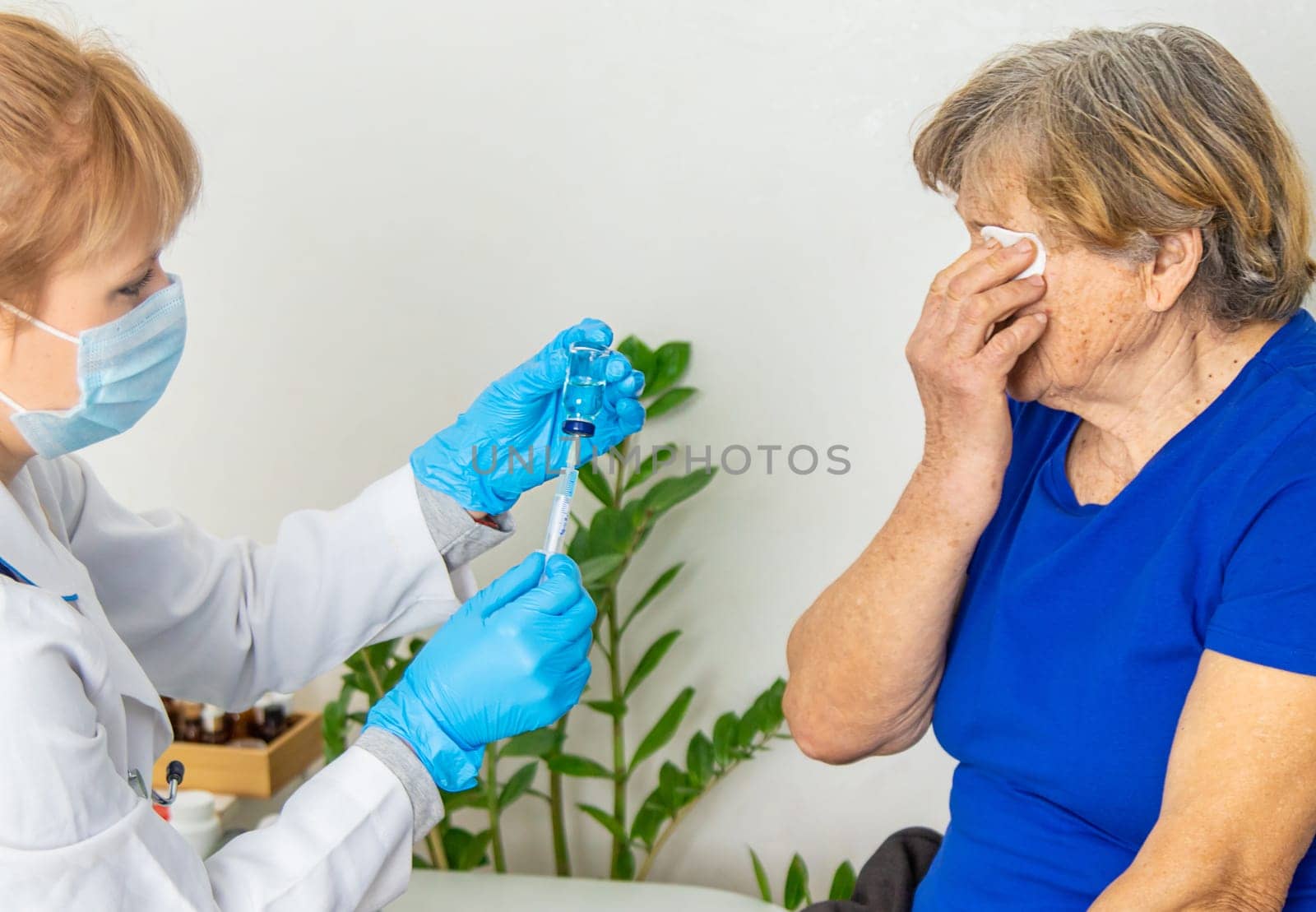 Elderly woman at a doctor appointment. Selective focus. People.