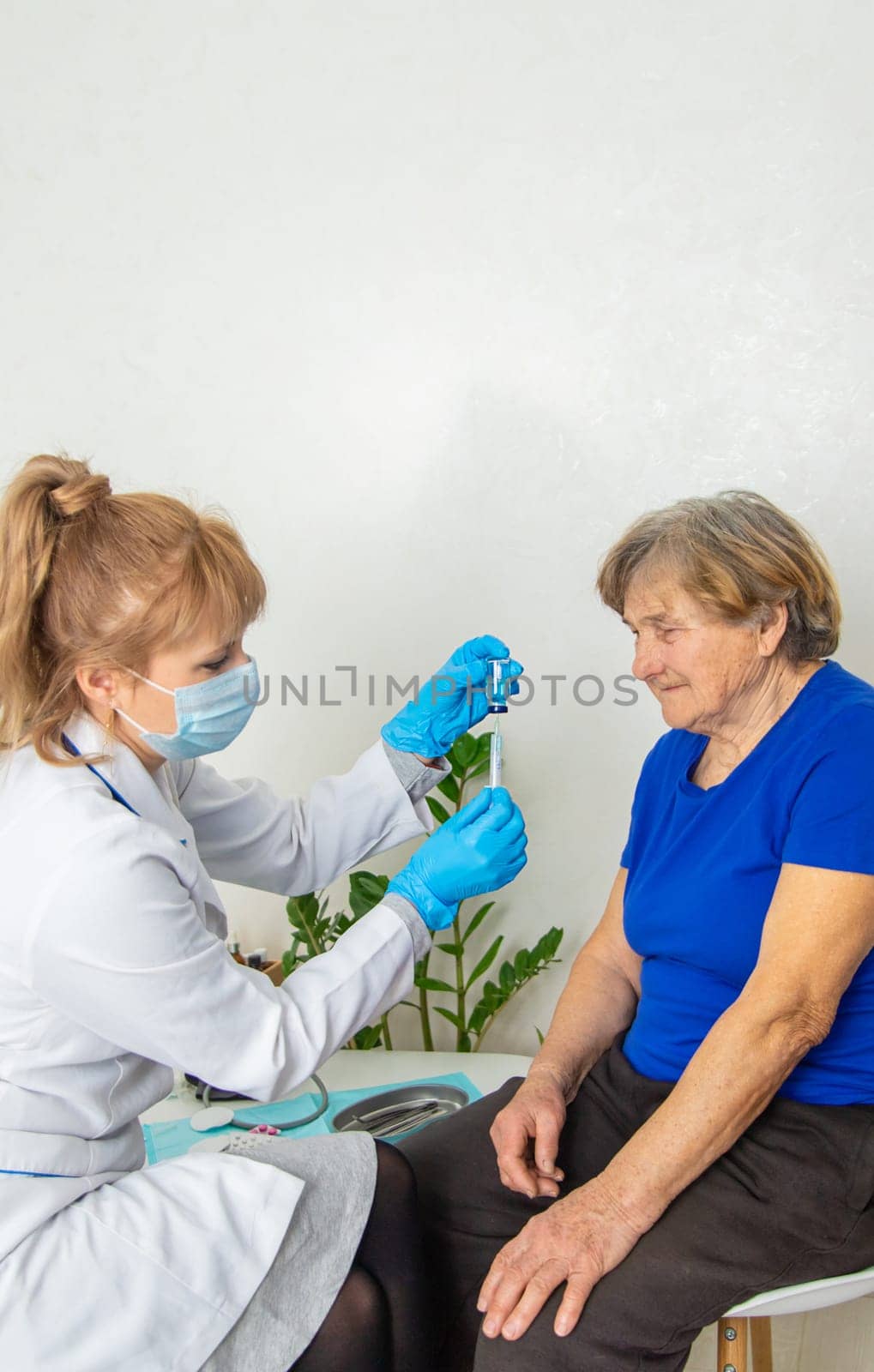 Elderly woman at a doctor appointment. Selective focus. People.