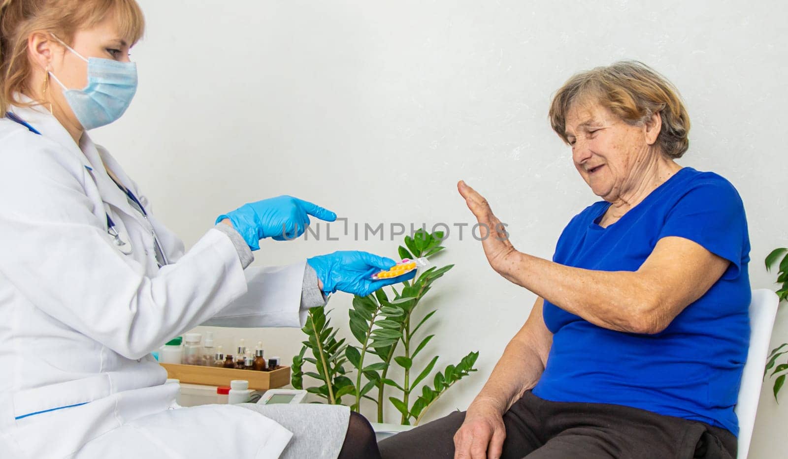 Elderly woman at a doctor appointment. Selective focus. People.