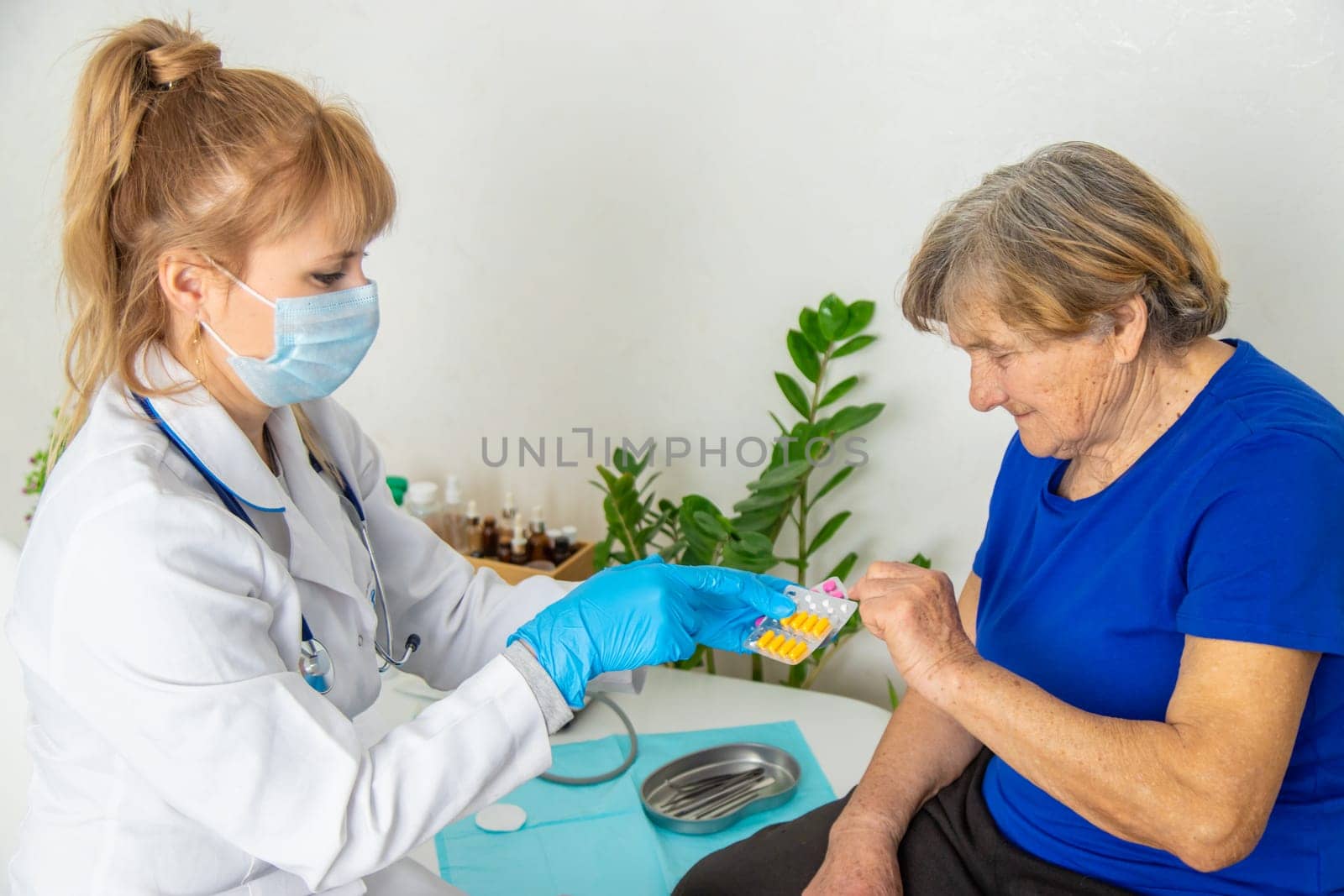 Elderly woman at a doctor appointment. Selective focus. People.