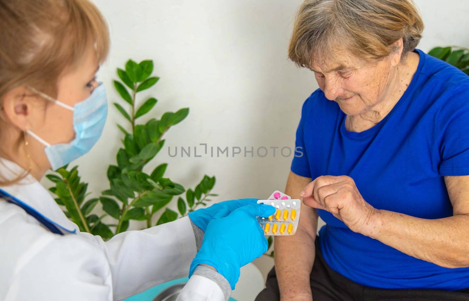 Elderly woman at a doctor appointment. Selective focus. People.